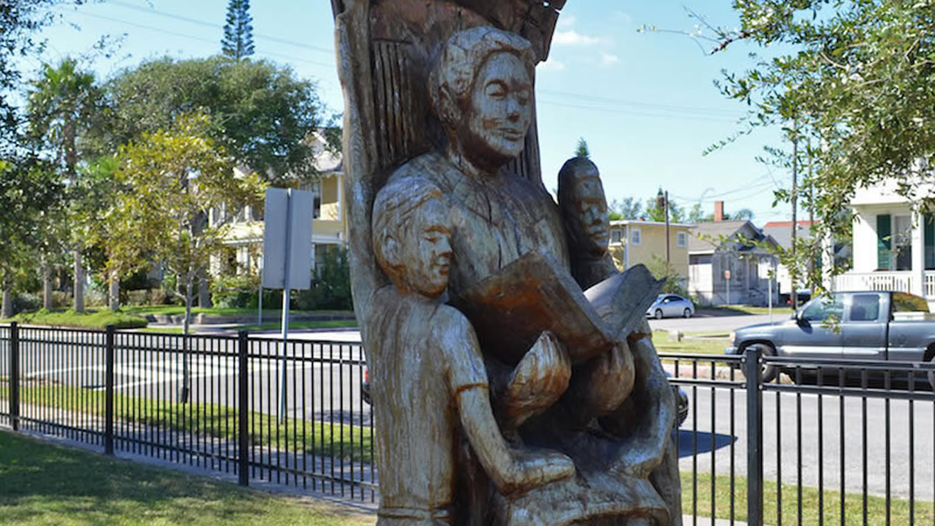 Grandmother Reading to Her Grandchildren Tree Sculpture