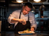 Chef Chris Lopez prepares a meal at BLVD. Seafood