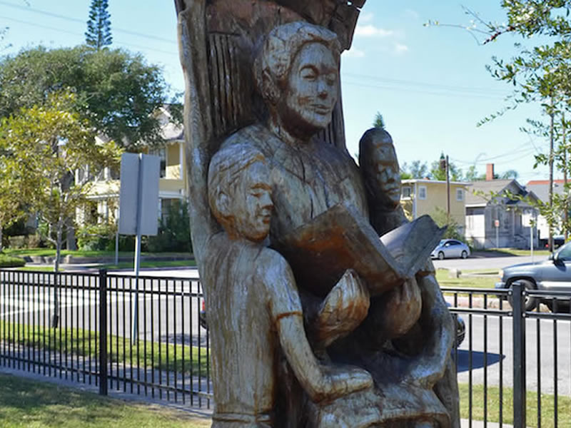 Grandmother Reading to Her Grandchildren