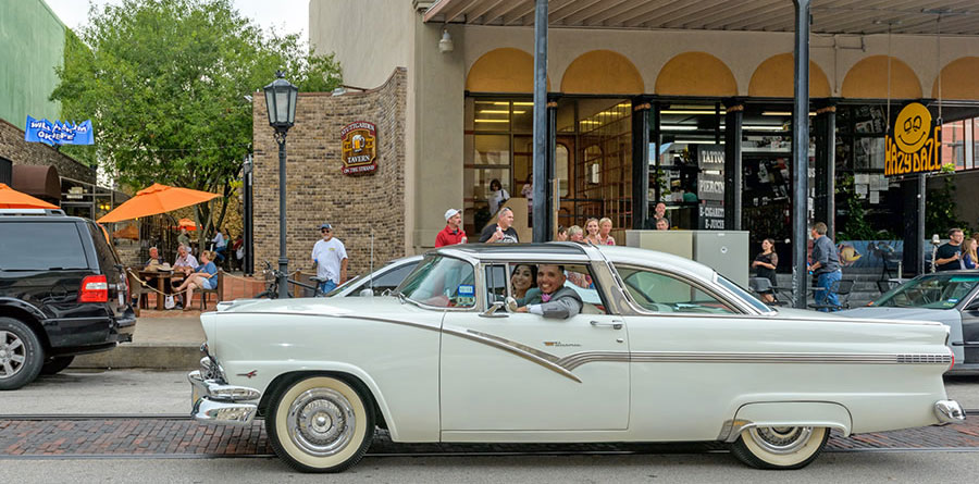 Couple in Classic Auto on The Strand