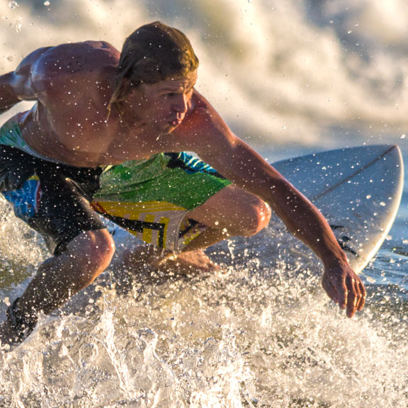 Young Male Surfing in the Gulf, Galveston TX