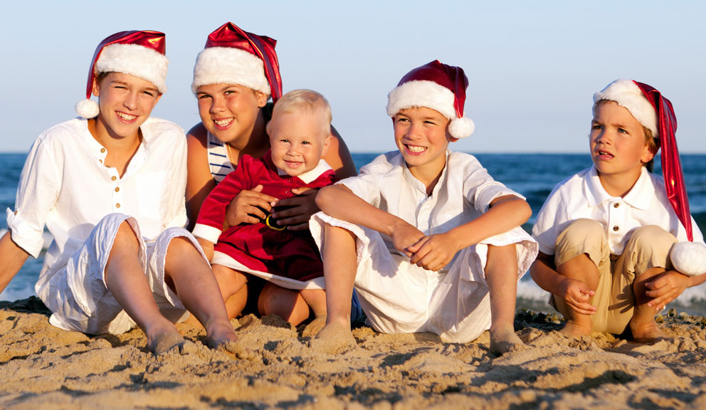 Children Sitting on the Beach with Santa Hats Winter Wonder Island, Galveston, TX