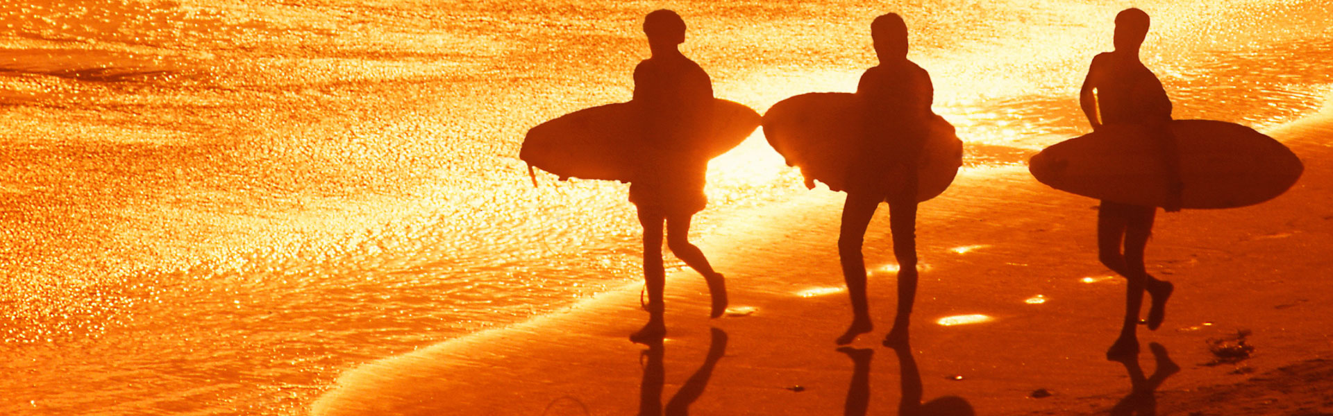 Surfers on the Beach at Sunset Surfers on the Beach at Sunset, Galveston, TX