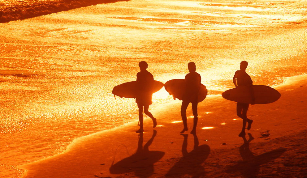 Surfers on the Beach at Sunset, Galveston, TX