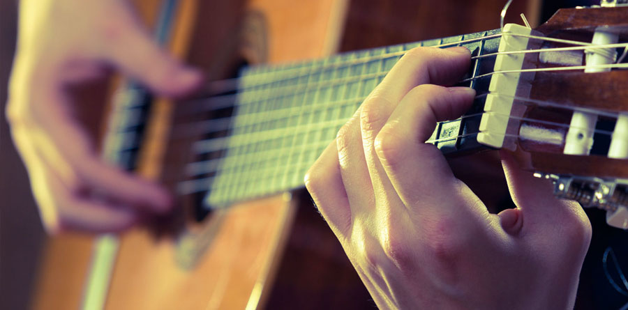 Musician Playing Acoustic Guitar
