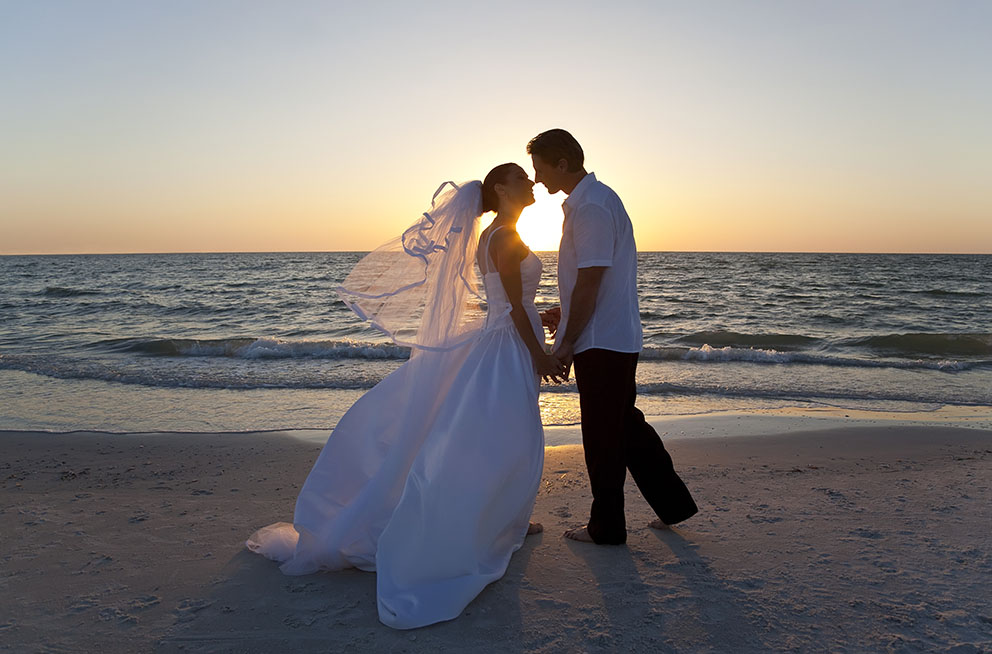 Couple Getting Married on Beach Couple Getting Married on Beach
