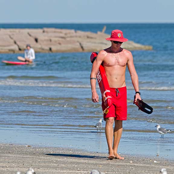 Lifeguard Beach Paddleboarder