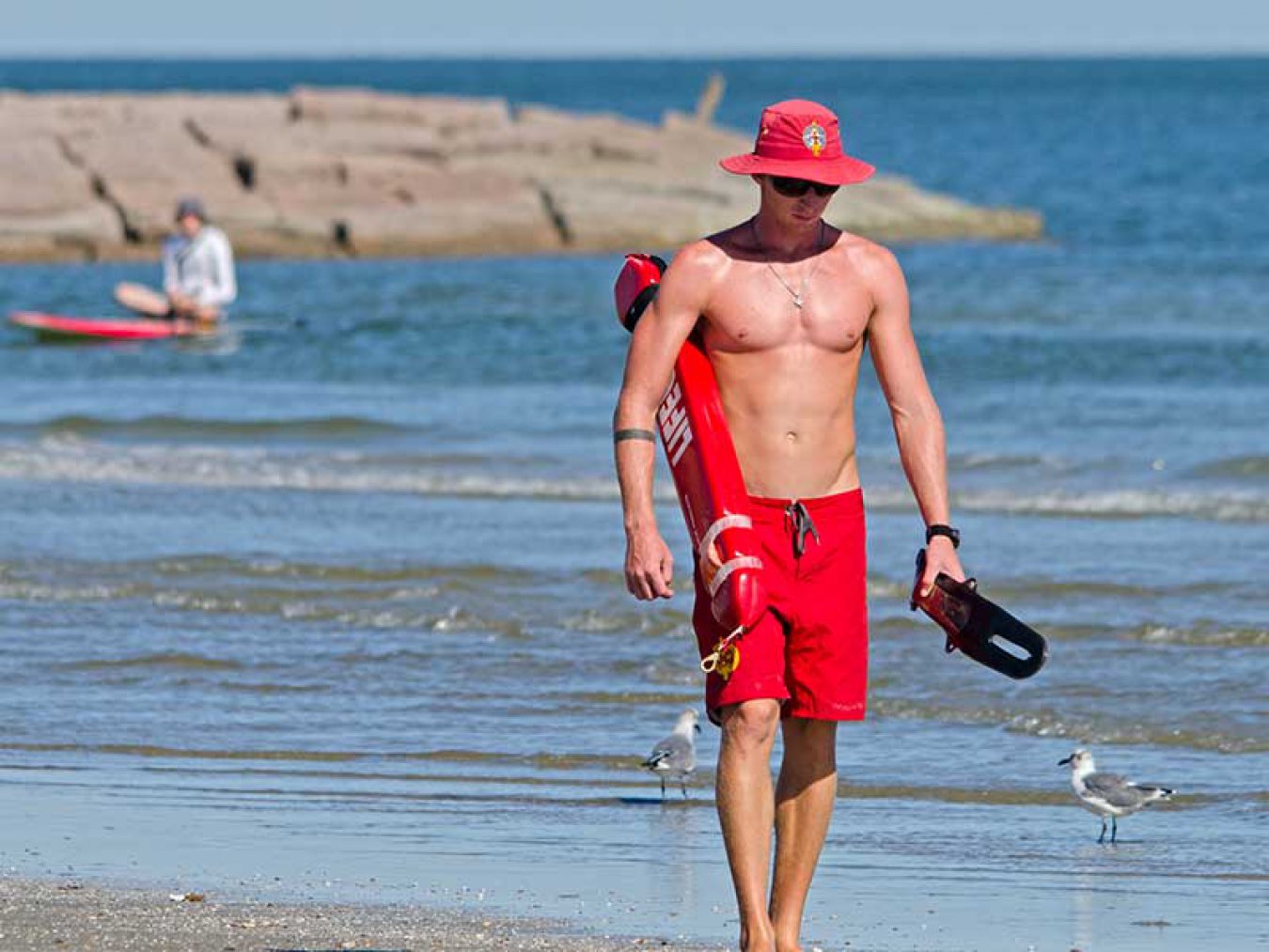 Lifeguard Beach Paddleboarder