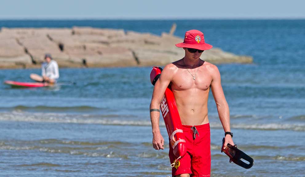 Lifeguard Beach Paddleboarder