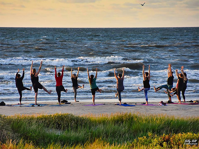 People Doing Yoga on Beach