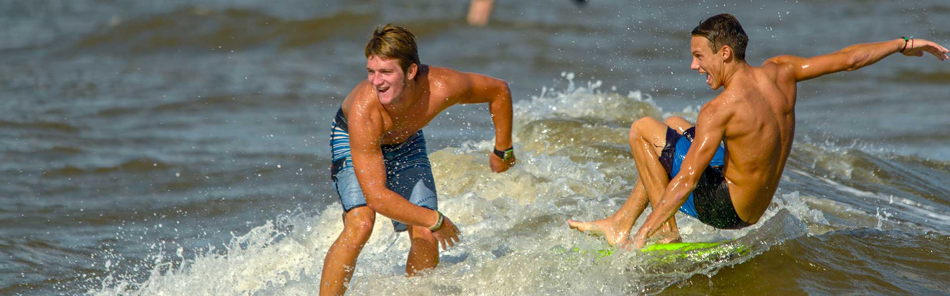 Boys Surfing at the Beach