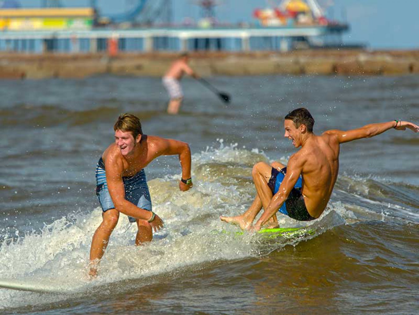 Boys Surfing at the Beach