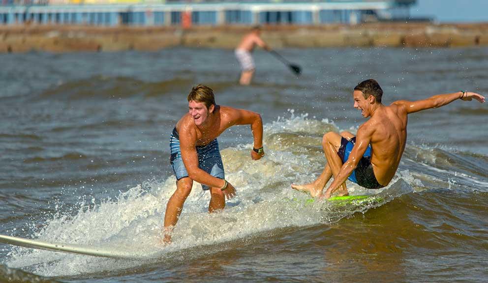 Boys Surfing at the Beach