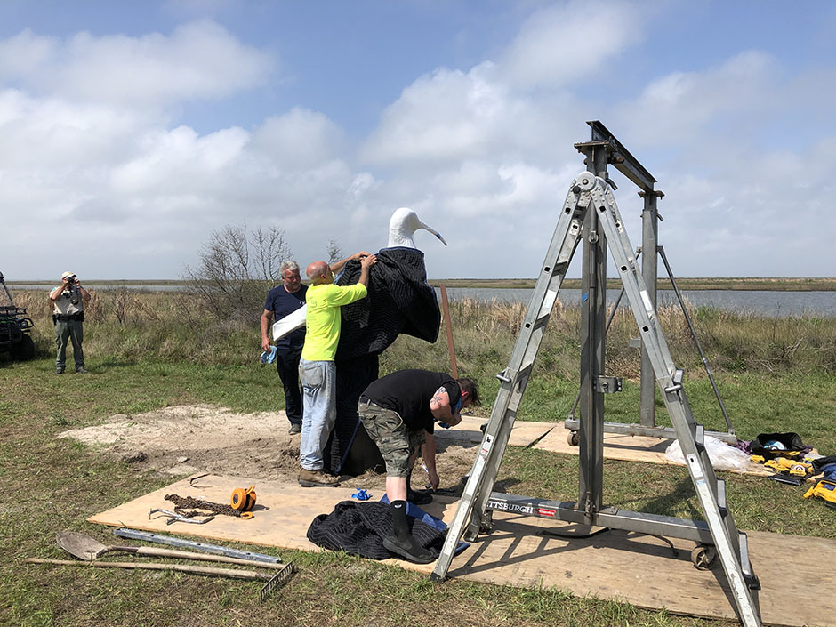 Crew Installing Sculpture