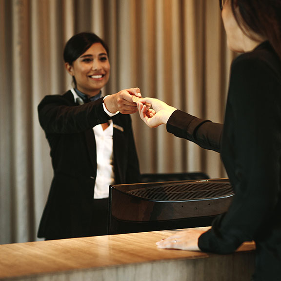 Guest Checking into Hotel Casa del Mar with Flowers