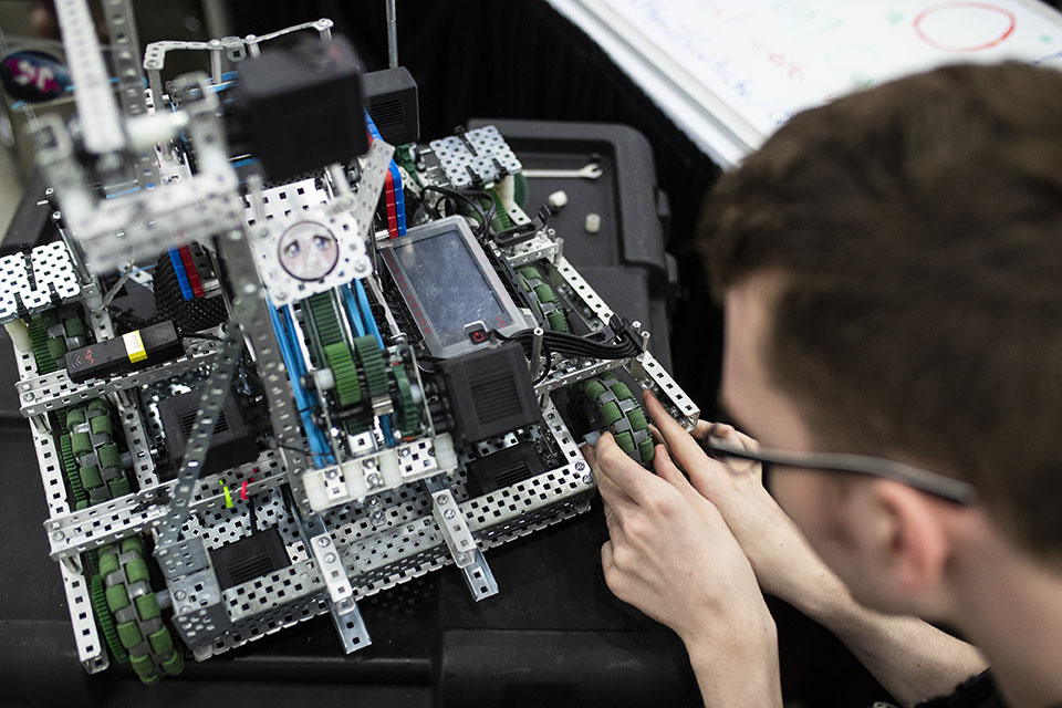 Guy Working on Robot