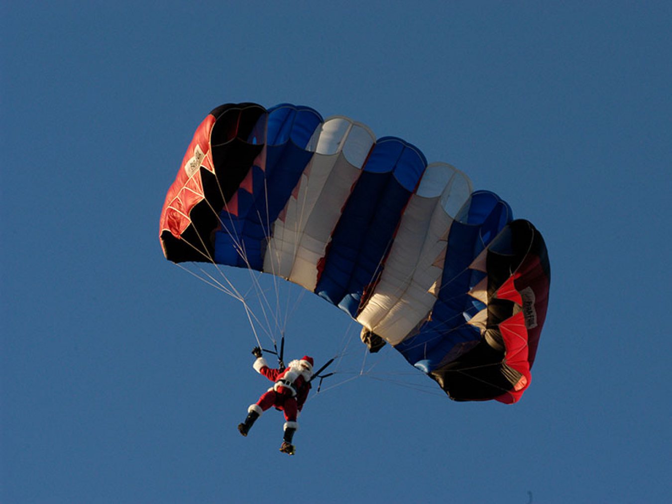 Santa Parachutes to Moody Gardens