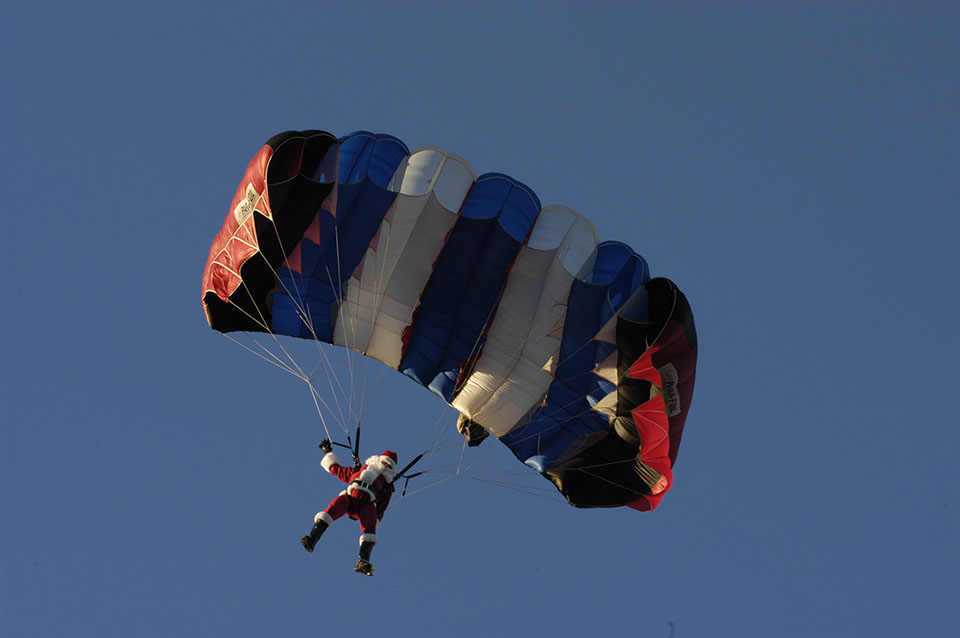 Santa Parachutes to Moody Gardens