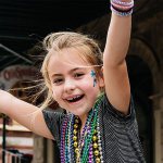 Girl Catching Beads on the Strand