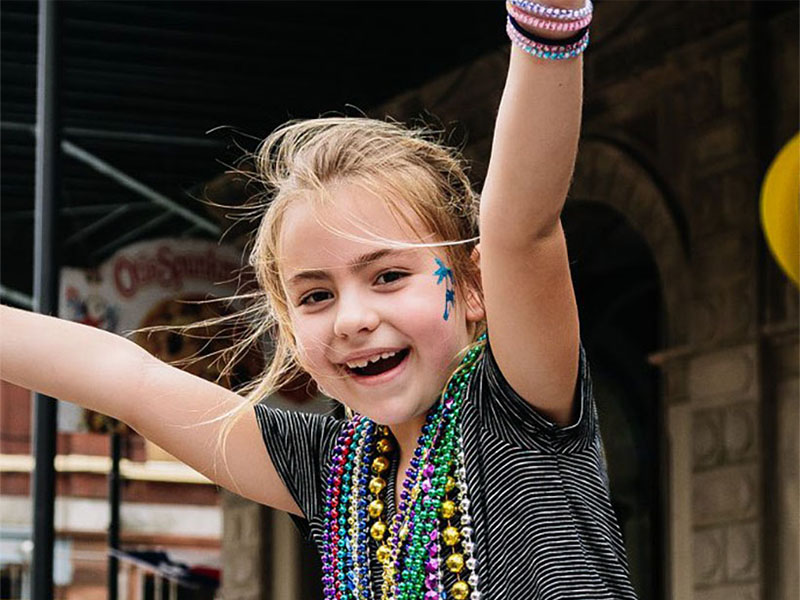 Girl Catching Beads on the Strand