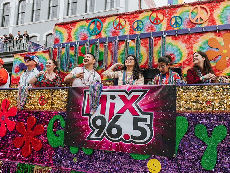 Mix 96.5 Float with Riders Throwing Beads