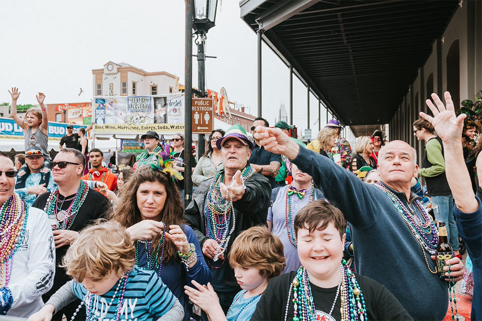 People Catching Beads on The Strand