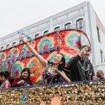 People on Float Throwing Beads