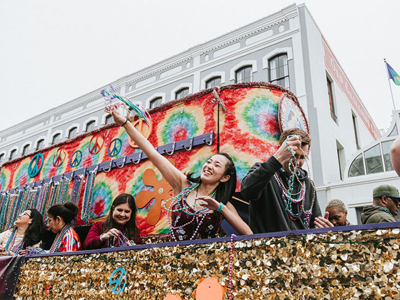 People on Float Throwing Beads