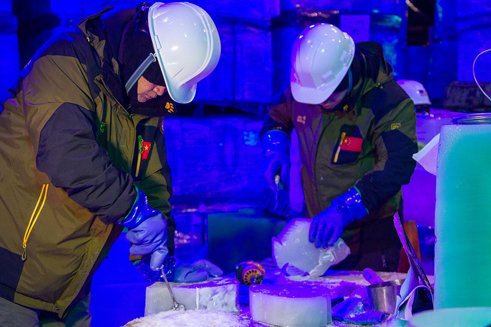 Ice Carvers Sculpting a Caribbean Christmas