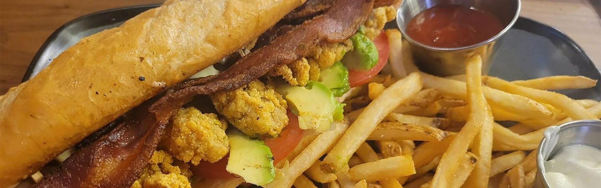 Shucks Oyster Bar Poboy and Fries Benno's Cajun Seafood, Galveston, TX